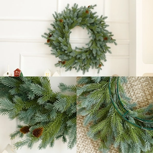 Artificial Christmas wreath with green pine needles and natural pine cones for home decor