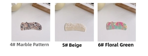 Detail of acetate hair combs in marble, pearlescent beige, and floral pattern designs