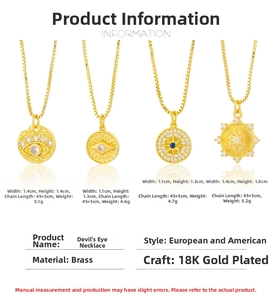 Detail of 18K gold plated brass necklaces with evil eye and compass star pendants