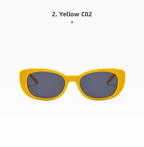 Detail of yellow cat eye sunglasses C02 with wide frames and dark grey lenses