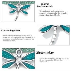 Macro detail of 925 silver dragonfly charm with green enamel and 3A grade zircon stones