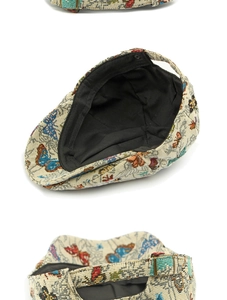 Detail of butterfly jacquard fabric texture and adjustable metal buckle on beret cap