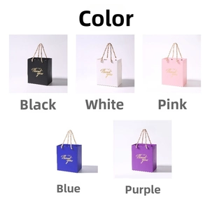 Detail of paper gift bags in five colors with metal chain handles and gold Thank You text