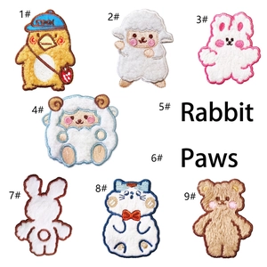 Detailed view of various cute 3D plush embroidered animal patches for DIY decoration