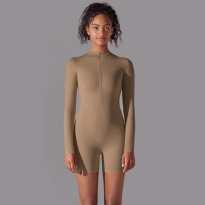 Detail of khaki long sleeve yoga romper with half-zip closure and slimming fit design