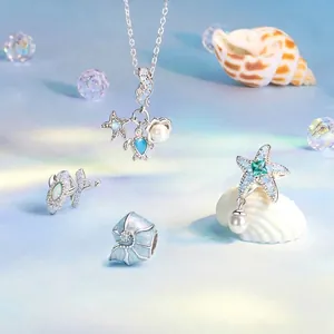 Marine jewelry set in S925 silver with sea turtle, starfish charms, and blue opal accents