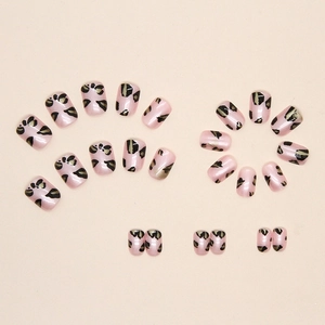 Pink leopard print press-on nails set with glossy finish and diverse sizes on beige background