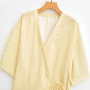 Chic yellow striped kimono top with V-neck wrap design and side tie closure