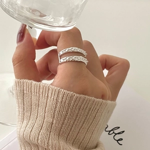 Minimalist silver 925 double-layer chain ring shown on a finger with aesthetic props