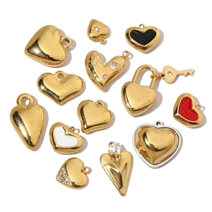 French vintage heart pendants in gold and silver steel with enamel and zircon details