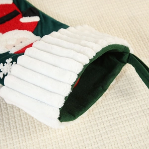 Green velvet Christmas stocking with Santa embroidery and plush white cuff for home decor