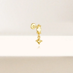 Macro detail of S925 sterling silver stamp on golden earring with yellow zircon gems