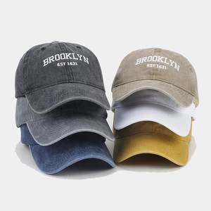 Close-up of vintage washed cotton baseball caps with Brooklyn 1631 embroidery detail