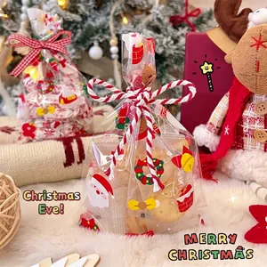 Christmas themed clear treat bags featuring Santa and wreath patterns with cotton ties