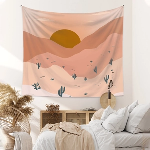 Detail of bohemian desert sunset tapestry hanging above a bed in a cozy bedroom