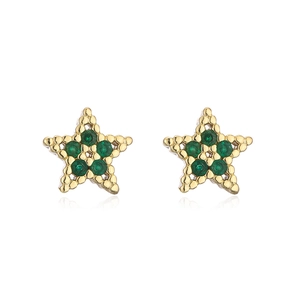 Detail of star-shaped stud earrings in gold with green zircon and beaded metal edges