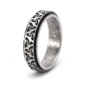 Macro detail of Celtic knot relief and vintage silver finish on rotatable steel ring