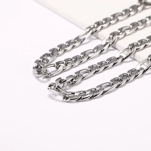 Close-up of polished silver stainless steel Figaro chain for men and women