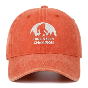 Close-up of orange washed cotton cap with Bigfoot Hide & Seek Champion embroidery