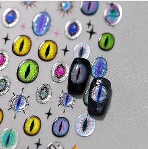 Macro view of 3D aurora cat eye nail stickers with mystical star and eye patterns