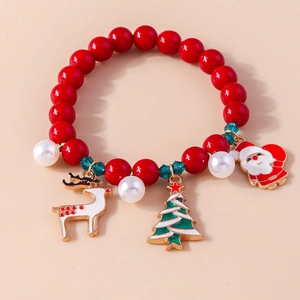 Detail view of Christmas beaded bracelet with Santa Claus and reindeer enamel charms