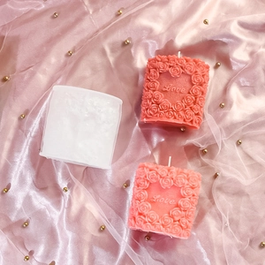 Macro detail of 3D rose heart silicone mold with Love text engraving for DIY candles