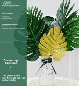 Macro detail of high realism artificial monstera leaves in deep green and metallic gold finish