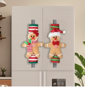 Close-up of festive gingerbread man refrigerator handle covers in a home kitchen setting