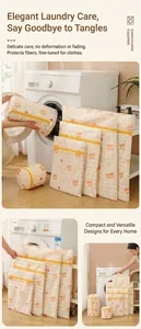Detailed view of mesh laundry bags with bear prints and yellow plaid patterns in various sizes