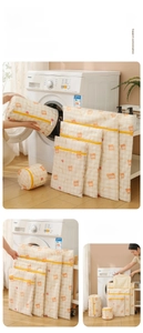 Detailed view of mesh laundry bags with bear prints and yellow plaid patterns in various sizes