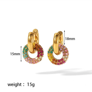 Macro shot of 18k gold earrings showing colorful rhinestones and 18mm ring dimensions