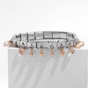 Detail of stainless steel modular bracelet with pink heart charms and rose gold accents