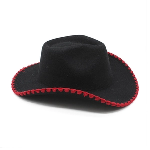 Detail of black western cowboy hat featuring vibrant red woven stitching on the curved brim