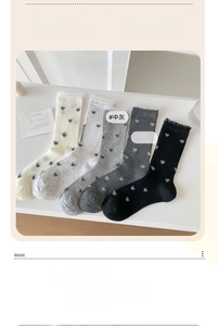 Detail of five-pair set of ultra-thin mid-calf socks with black bow patterns and lace trim