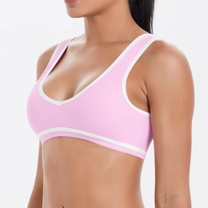 Vue latérale du soutien-gorge de sport rose et blanc en tissu brossé et respirant