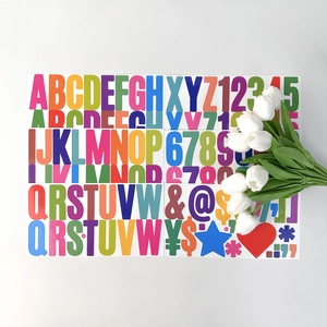 Macro view of multi-colored self-adhesive alphabet and number stickers with glossy finish