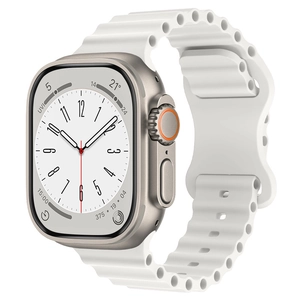 Detail of white silicone wavy ocean band and gold casing for Apple Watch Ultra