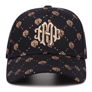 Black baseball cap with gold 3D embroidery and all-over pattern for sun protection