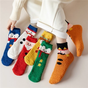 Cozy coral fleece Christmas socks featuring reindeer, Santa and snowman patterns in multiple colors