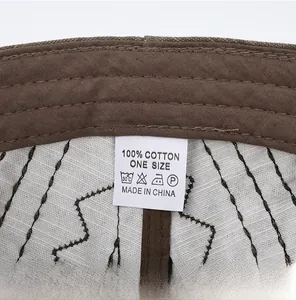 Detail view of cotton flat cap interior with 100% cotton label and wave stitching