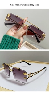 Detail of gold double-bridge sunglasses with cheetah head ornament and gray lenses