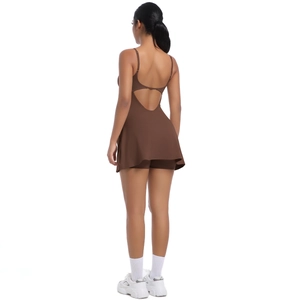 Detail of cross-back straps and built-in shorts on a brown athletic tennis dress