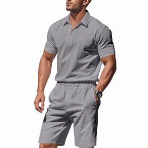Detail of grey short sleeve polo and matching drawstring shorts set in breathable fabric