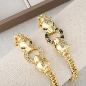 Golden panther head link bracelet with green eyes and pave-set colorful zircons