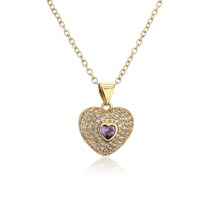 Detail of gold necklace featuring a heart pendant with micro-pave purple zircon stones