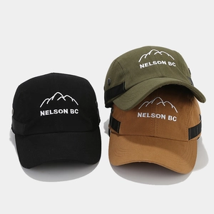 Detailed embroidery of mountain peaks and Nelson BC text on multi-color cotton caps