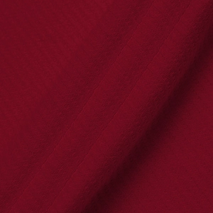 Macro shot of dark red men's polo shirt fabric showing dense knit texture and details