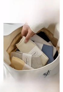 Detailed view of ribbed cotton mid-calf socks in diverse colors with card packaging