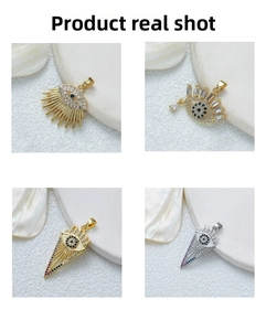 Macro detail of gold and silver plated evil eye pendants with micro-pave zircon stones