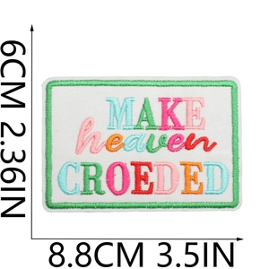Close-up of MAKE heaven CROWDED embroidered patch with dimensions 8.8cm by 6cm